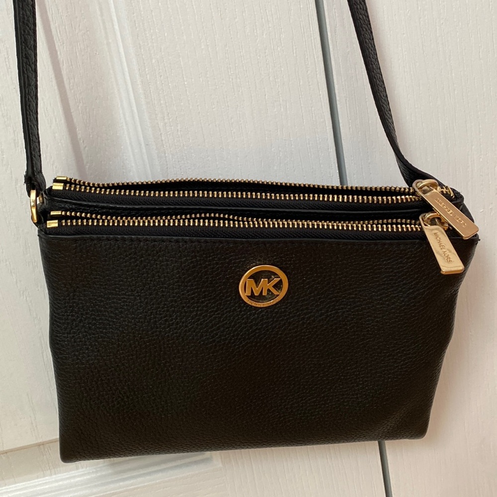 Michael Kors black crossbody purse with matching mini pink wallet